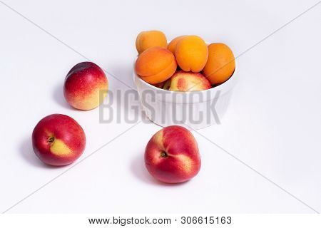 Group Of Whole Nectarine And Apricots Fruit Isolated On White Background.
