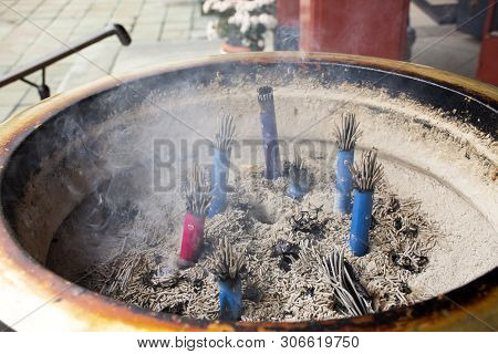 Japanese People And Foreign Travelers Praying Buddha God And Angel Statue With Joss Stick In Thuribl