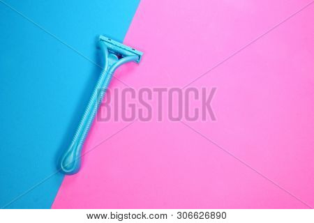 Prague, Czech Republic - May 20, 2019: Gillette Venus shaving razor for women, on a blue and pink surface