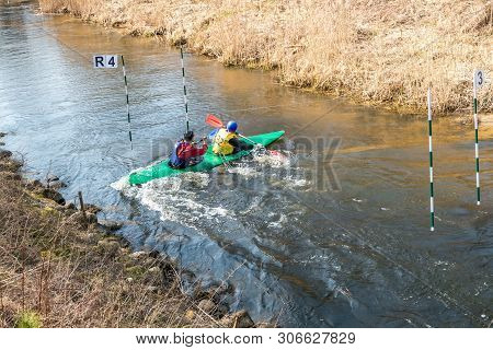 Grodno, Belarus - April, 2019: Kayak Freestyle Competition On Fast Cold Water River Strenuously Rowi