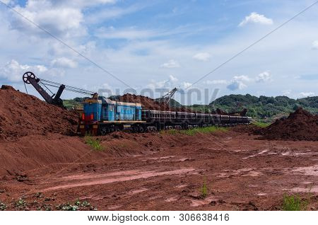 Excavator Loading Clay To The Train