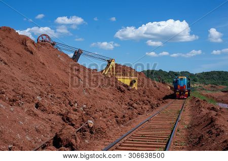 Excavator Loading Clay To The Train