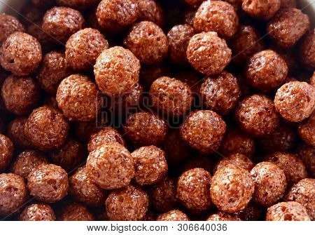 Close Up Of Chocolate Cornflakes In A Bowl, A Breakfast Cereal Made By Toasting Flakes Of Corn Or Ma