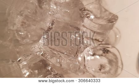 Blurry Melting Ice Cubes Texture Closeup. Icing Texture. Frozen Textured Background. Drinking Refres
