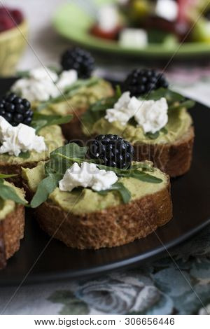 A Gourmet Lunch: A Plate Of Guacamole Sandwiches With Blackberries, Cream Cheese And Aragula, A Bowl