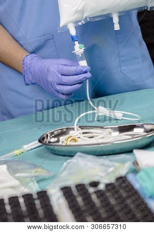 Nurse Preparing Medication For Parenteral Nutrition In A Hospital, Conceptual Image