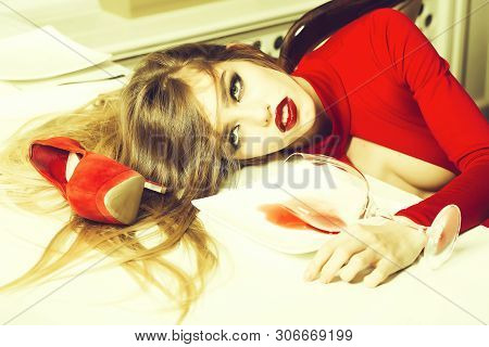 Sensual Elegant Glamour Young Drunk Woman With Beautiful Hair Lying On Table With Glass And Poored R