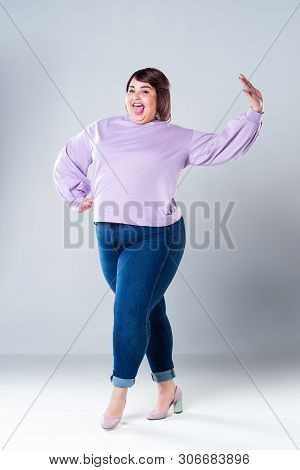 Happy Plus Size Model In Casual Clothes, Fat Woman On Gray Background, Body Positive Concept