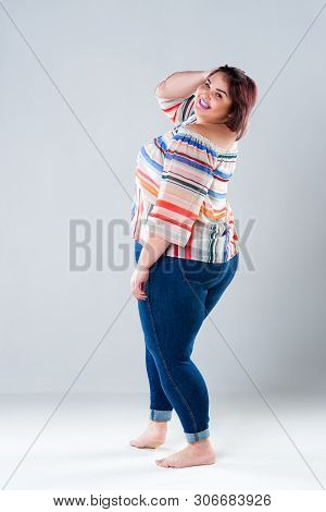Happy Plus Size Fashion Model In Casual Clothes, Fat Woman On Gray Background, Body Positive Concept