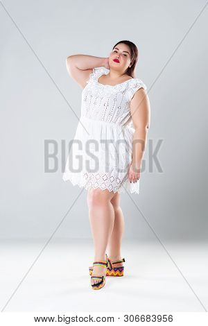 Plus Size Fashion Model In White Dress, Fat Woman On Gray Background, Body Positive Concept