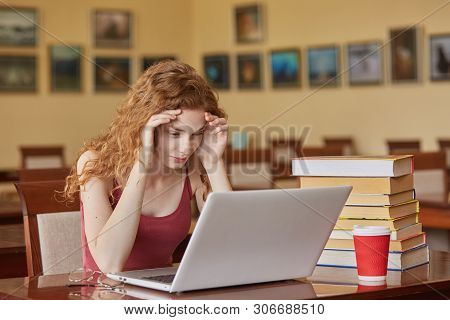 Task, Test, Learning And Education Concept. Intelligent, Reader Girl Wearing Casually Sitting At Des