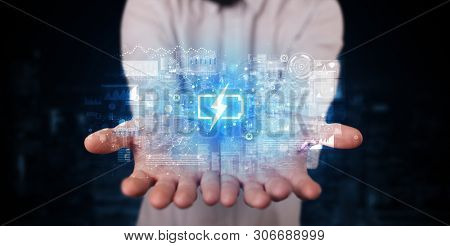 Elegant hand holding battery with full of energy