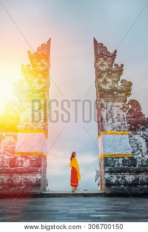 Tourist Visiting Lempuyang Temple, Bali Indonesia. History And Religion