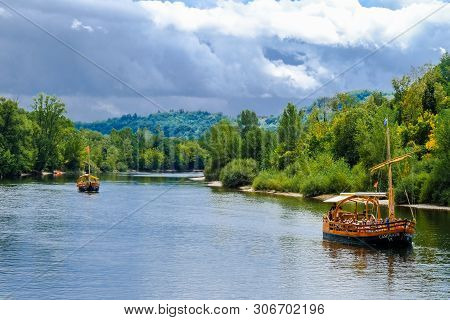 La Roque Gageac, France - August 09, 2018: Two Gabares On The Dordogne River. Gabares Are Traditiona