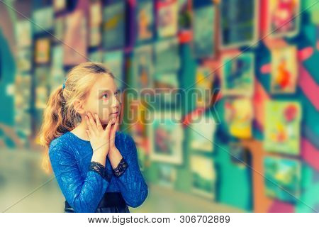 The Girl In The Art Gallery Looks At Works Of Art And Admires The Works Of Great Masters Of Art.