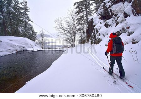 A Backcountry Cross-country Skier Traverses The Portage Between Freeland And George Lakes In Killarn