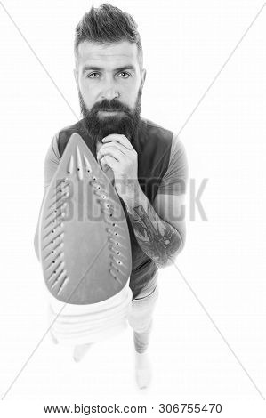 How To Properly Use Steam Iron. Man Bearded Hipster Hold Electric Ironing Tool. How Iron Clothes Cor
