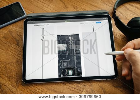Paris, France - Jun 6, 2019: Man Reading On Apple Ipad Pro Tablet About Latest Announcement Of At De