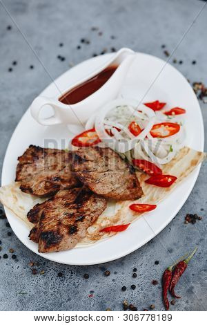 Barbecue Dry Aged Wagyu Fillet Steak With Vegetable And Lettuce As Top View On A Modern Design Plate