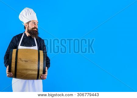 Viticulture Concept. Winemaker With Cask Or Barrel Of Wine. Alcoholic Product On Wine Making Festiva