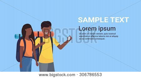 Couple Tourists Hikers With Backpacks Using Compass Searching Direction Hiking Concept Man Woman Afr
