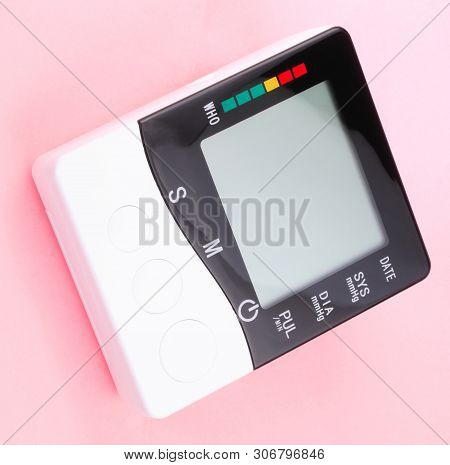 Blood Pressure Monitor On Pink Background At Dry Sunny Summer Day