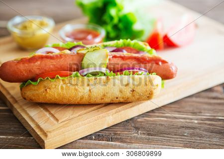 Delicious Fast Food. Hot Dog With Grilled Sausages, Onions And Vegetables.