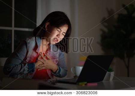 Candid Of Young Asian Woman Or Student Work Late Sitting On Desk With Computer Laptop At Home Office