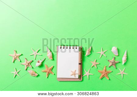 Blank Note Book With Starfish Or Seashells On A Green Background , Summer Vaction Concept