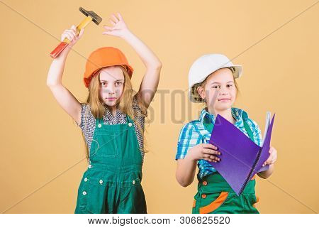 Happy Children. Future Career. Small Girls Repairing Together In Workshop. Labor Day 1 May. Little K