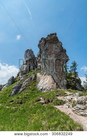 Limestone Rocks With Grass, Hiking Trail And Blue Sky On Ostra Hill In Springtime Velka Fatra Mounta