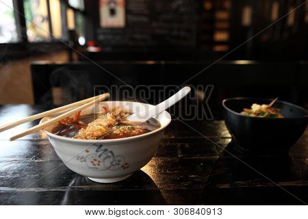 Udon Noodles With Shrimp Tempura On A Bowl