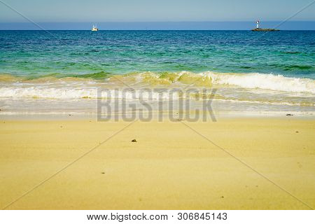 Seascape Sandy Beach Sea Shore With Lighthouse On Horizon. Andoya Island Bleiksstranda Beach. Vester