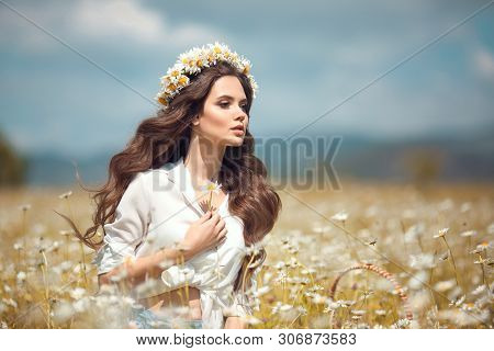 Beautiful Young Girl With Flower Enjoying In Chamomile Field. Carefree Happy Brunette Woman With Cha