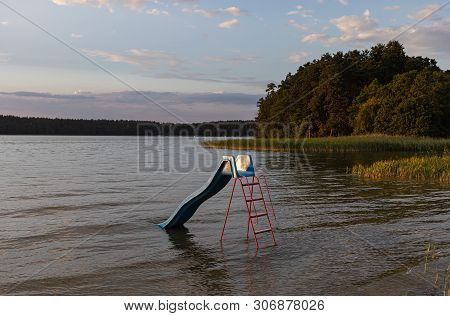 Recreation Area By The Lake. Beautiful View Of The Biale Lake, Poland In Hot Summer