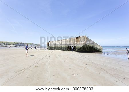 Arromanches , France - August 14, 2016: The Remains Of The Mulberry Harbour At Arromanches