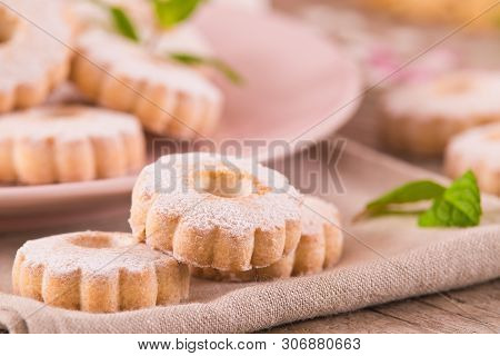 Canestrelli Biscuits With Mint On Wooden Table.