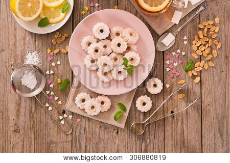 Canestrelli Biscuits With Mint On Wooden Table.