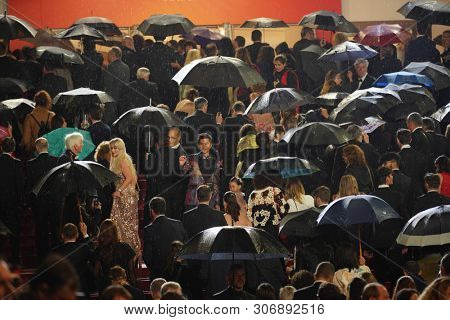 CANNES, FRANCE - MAY 18, 2019: Rain and umbrella details during red carpet of 