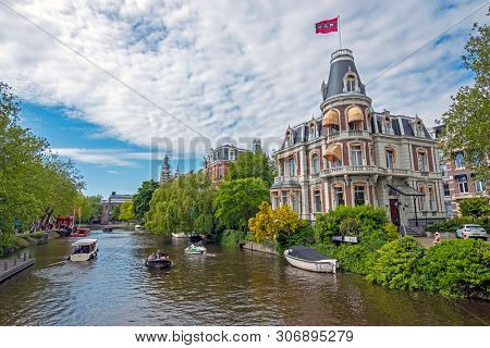 Amsterdam, Netherlands - May 16, 2019: Dutch house with the Amsterdam flag honoring the national championship from Ajax in Amsterdam the Netherlands