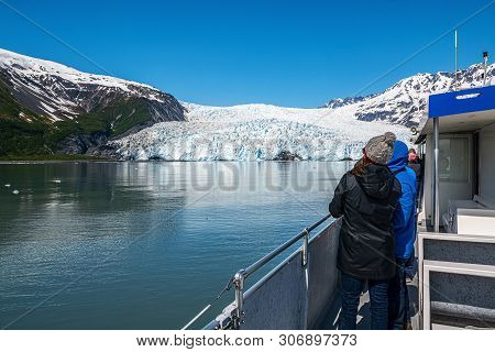 Visitors On A Boat Tour To The Aialik Glacier In Kenai Fjords National Park Near Seward Alaska.