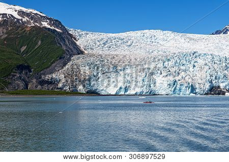 Visitors In A Kayak Approach The Mile Wide Aialik Glacier In Kenai Fjords National Park Near Seward 