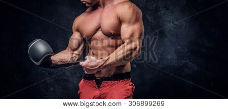Serious Muskular Man Get Prepared For Boxing, His Is Wearing His Boxer Gloves.