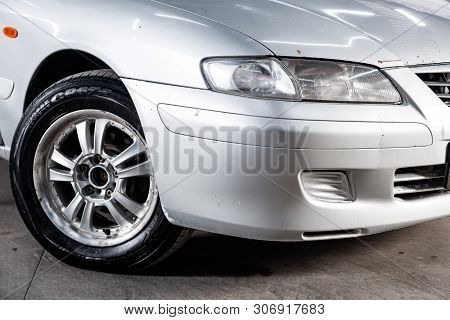 Novosibirsk, Russia - June 14, 2019:  Mazda Capella,  Close-up Of The Headlight, Bumper, Wheel. Phot