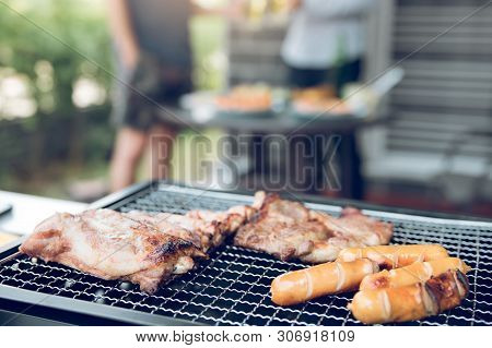 Close Up Grill With Meat And Sausage Ready For Socializing Celebrate With Friends At Outsite Home.