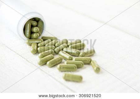 Close Up Of Organic Natural Green Asian Kariyat Plant Herbal Extract Medicine In Form Of Capsules Sp