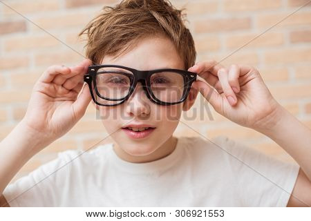 Handsome Teen Boy Wears Glasses. Poor Vision And Medicine Concept