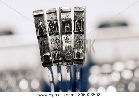 The word AMEN  with old typewriter  in monochrome 