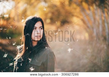 Dreamy Beautiful Girl In White Fluff On Bokeh Background With Yellow Leaves In Golden Sunlight. Insp