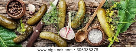 Homemade Pickles On Wooden Table